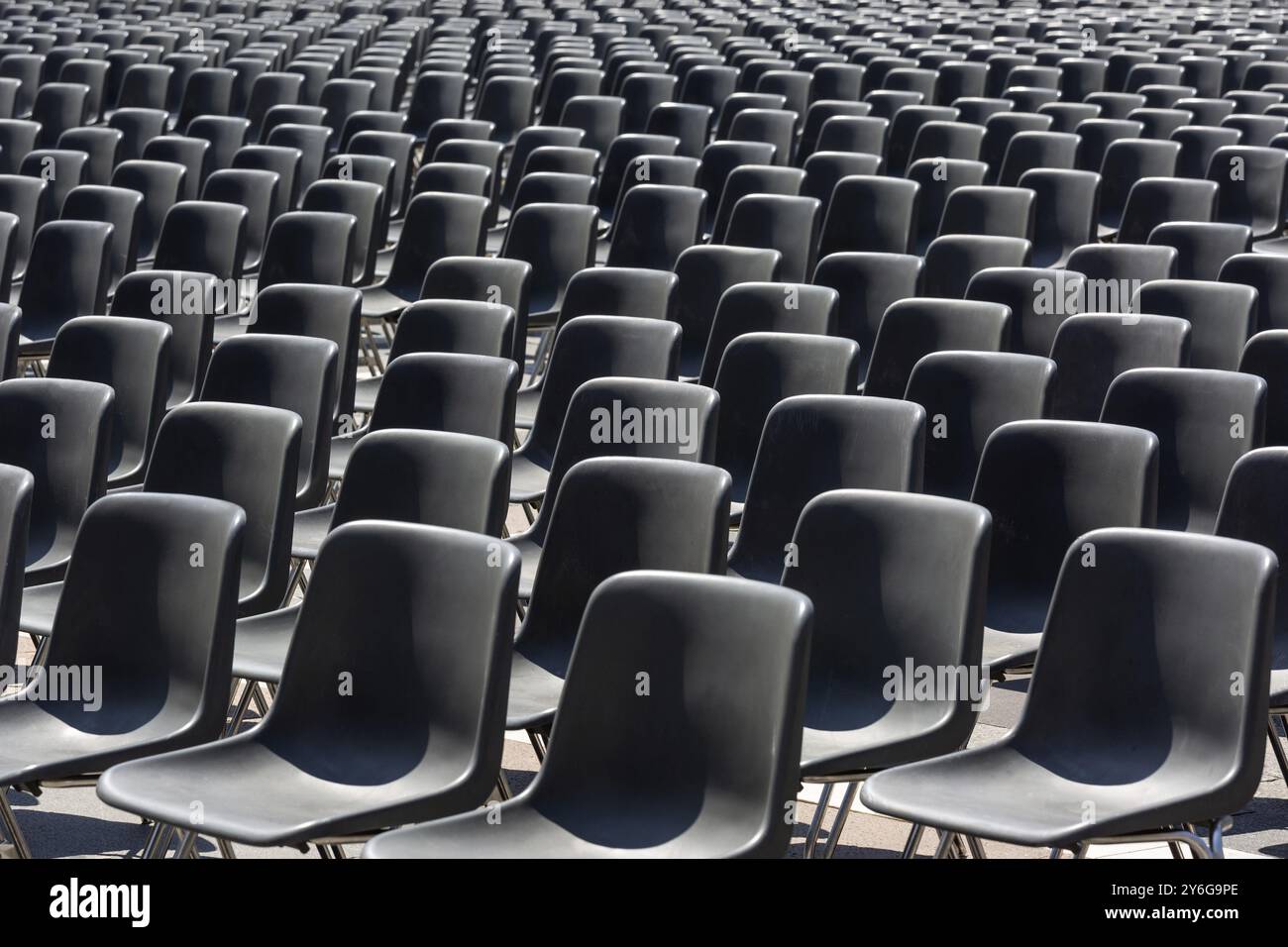 Rows of an empty black plastic seats Stock Photo