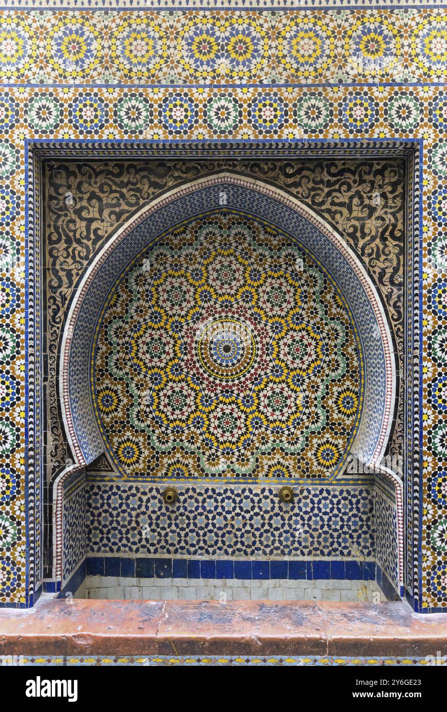 Traditional maroccan old fountain pattern tiled background Stock Photo