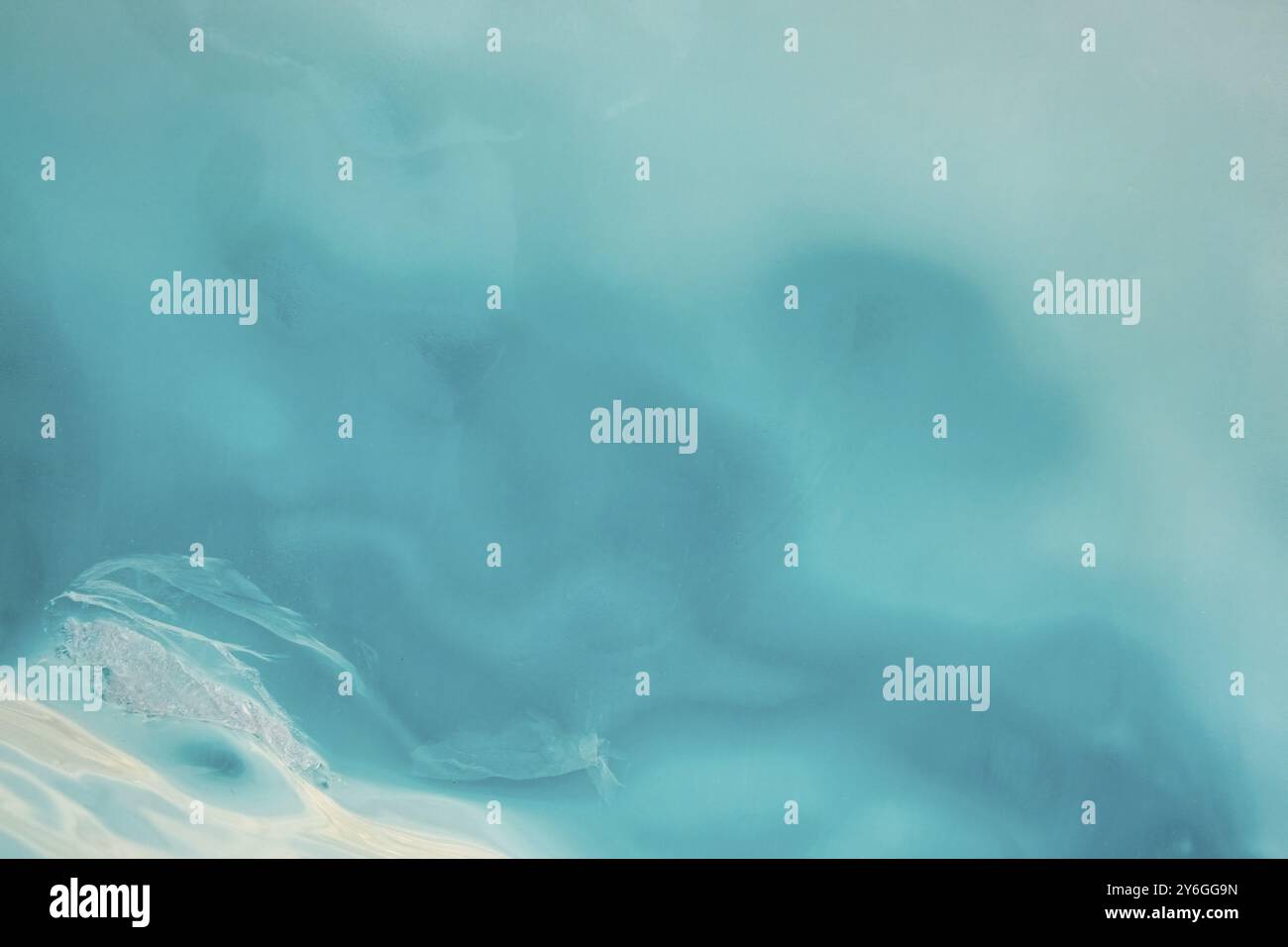Blue ice abstract textured background with light in ice Stock Photo