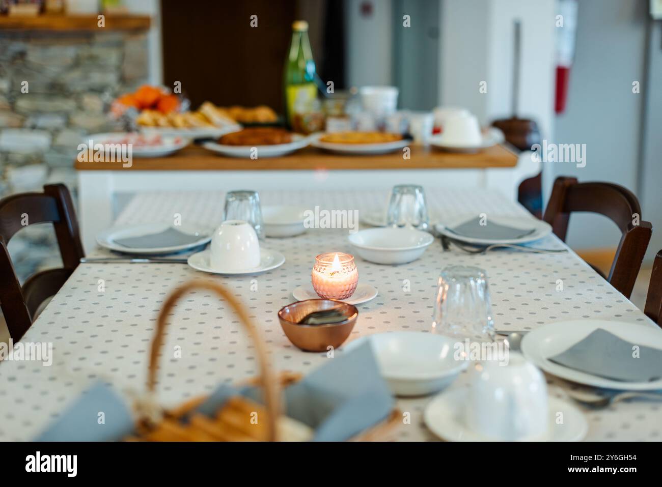 Breakfast table in a mountain bed and breakfast in the italian Alps. Stock Photo