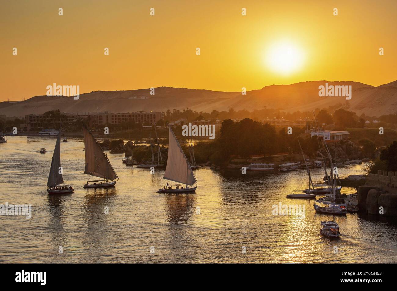 Beautiful view on felucca boats on Nile river in Aswan at sunset, Egypt ...