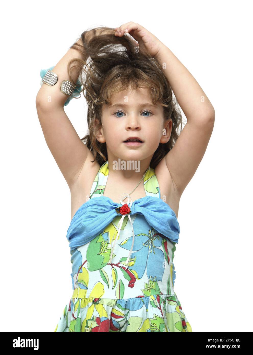 Adorable little girl raises her hair with hands Stock Photo - Alamy