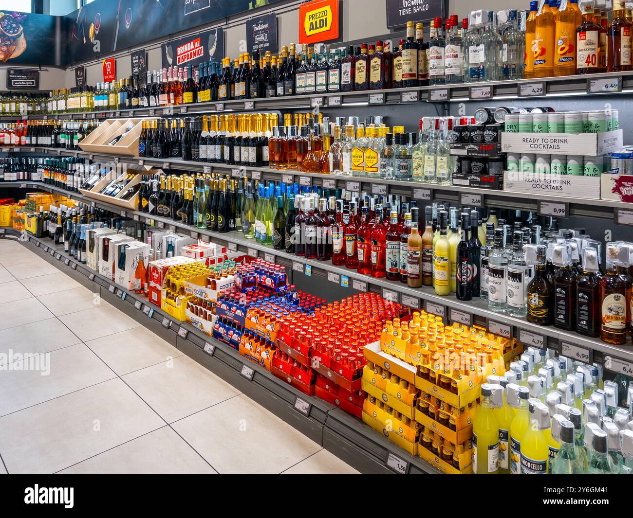 Fossano, Italy - September 25, 2024: Spirits, sparkling wines and liqueurs displayed on Aldi supermarket shelf for sale discount prices in Italian dis Stock Photo