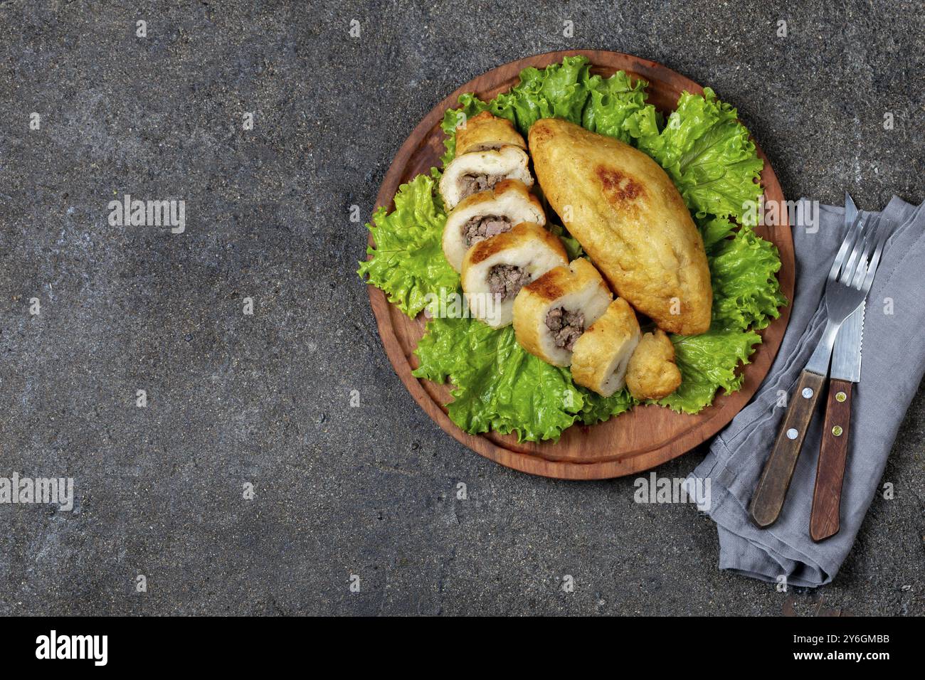 Food, Food, PERUVIAN CHILEAN traditional dish PAPA RELLENA meat stuffed mashed potato on wooden plate Stock Photo