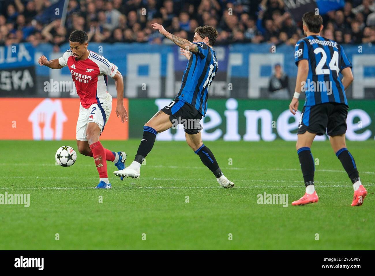 William Saliba of FC Arsenal in action during the UEFA Champions League 2024/2025 - League Phase MD1 football match between Atalanta BC and Arsenal FC Stock Photo