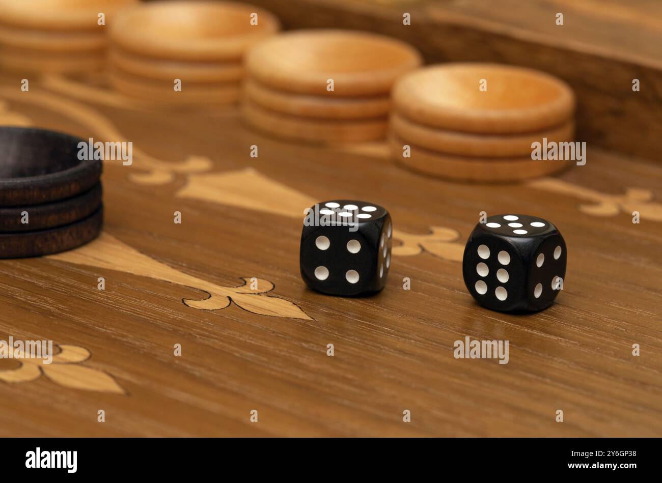 Dice on a backgammon board close-up macro Stock Photo