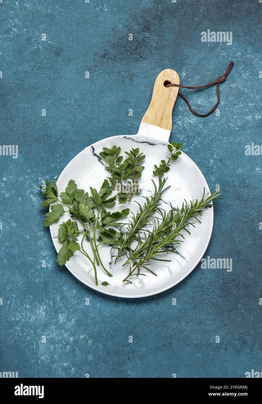 Food, Fresh herbs on white, blue background. Top view Stock Photo