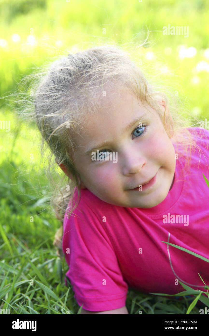Cute smiling little girl outdoor portrait Stock Photo - Alamy