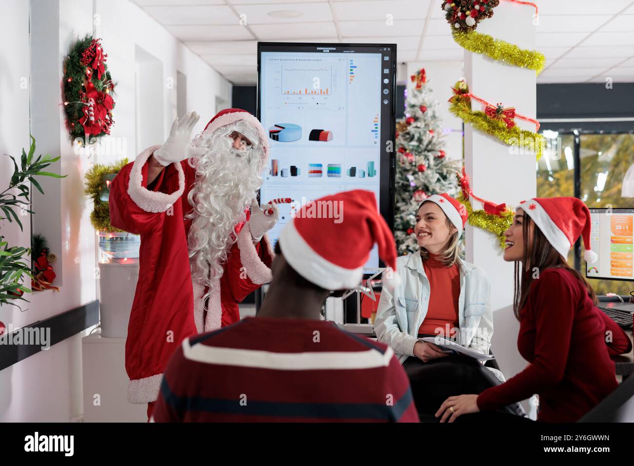 Coworker dressed santa claus hi-res stock photography and images - Alamy