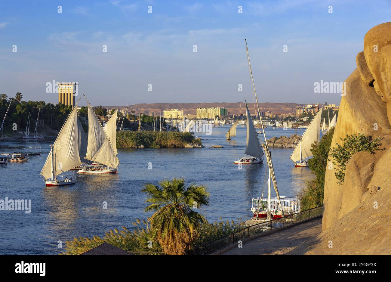 Beautiful landscape with felucca boats on Nile river in Aswan at sunset ...