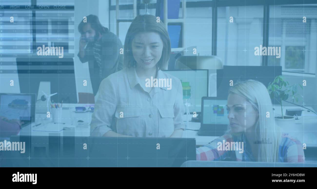 Image of diagrams and data processing over diverse colleagues discussing work Stock Photo