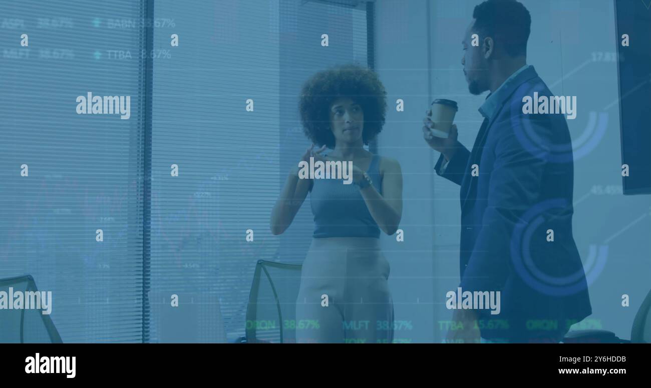 Image of diagrams and data processing over diverse colleagues discussing work Stock Photo