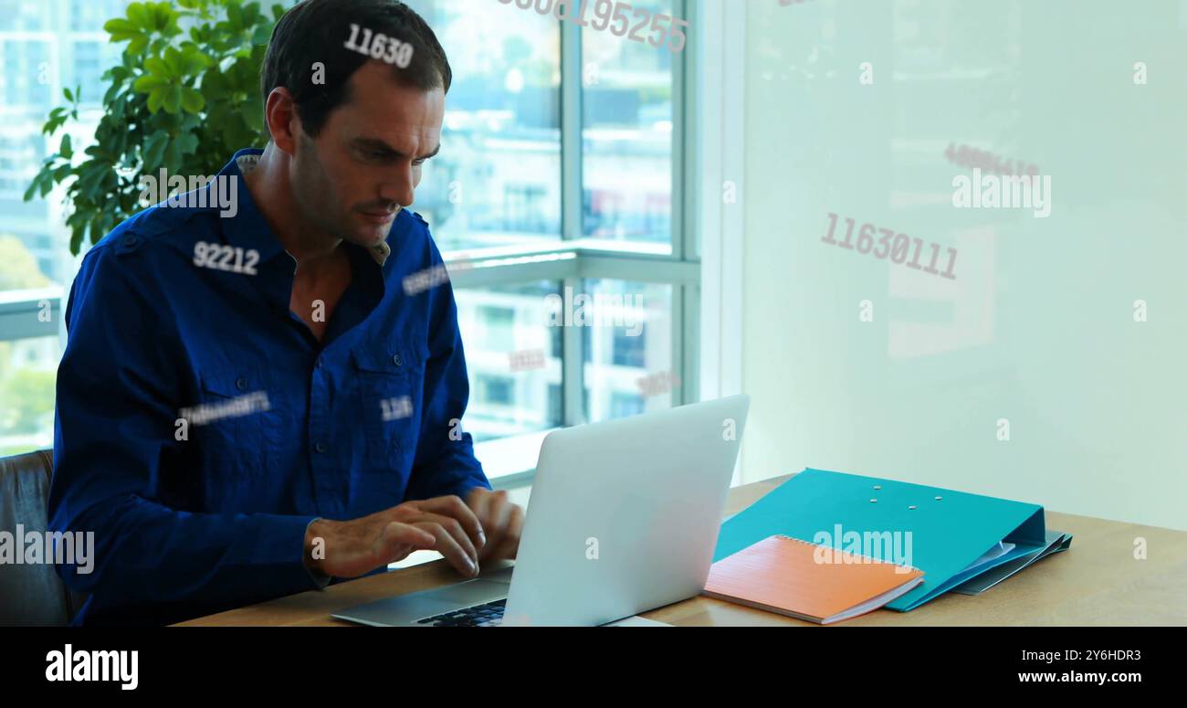 Image of data processing over biracial businessman using laptop in office Stock Photo
