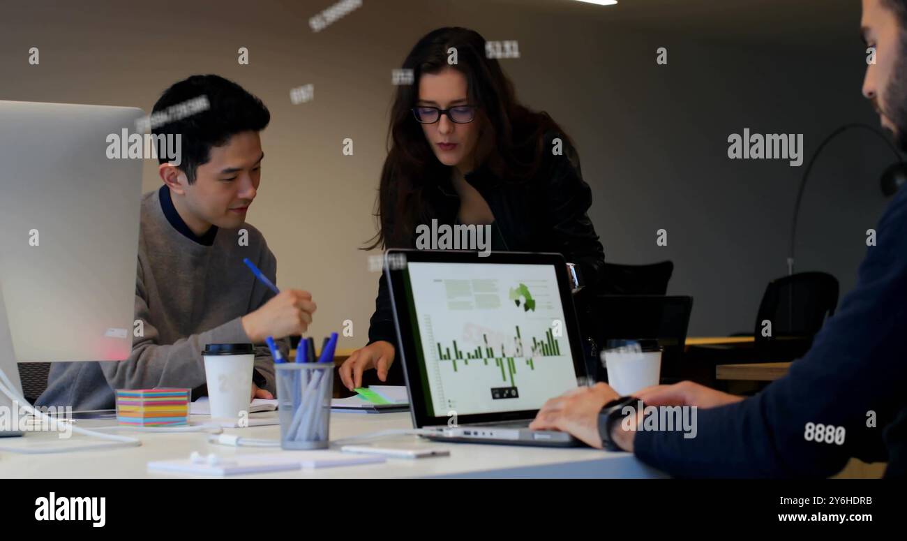 Image of data processing over diverse collleagues working in office Stock Photo