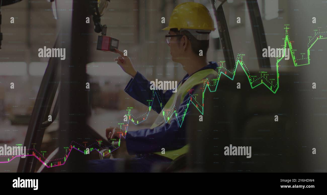 Image of financial data processing over asian male worker using lift truck in warehouse Stock Photo