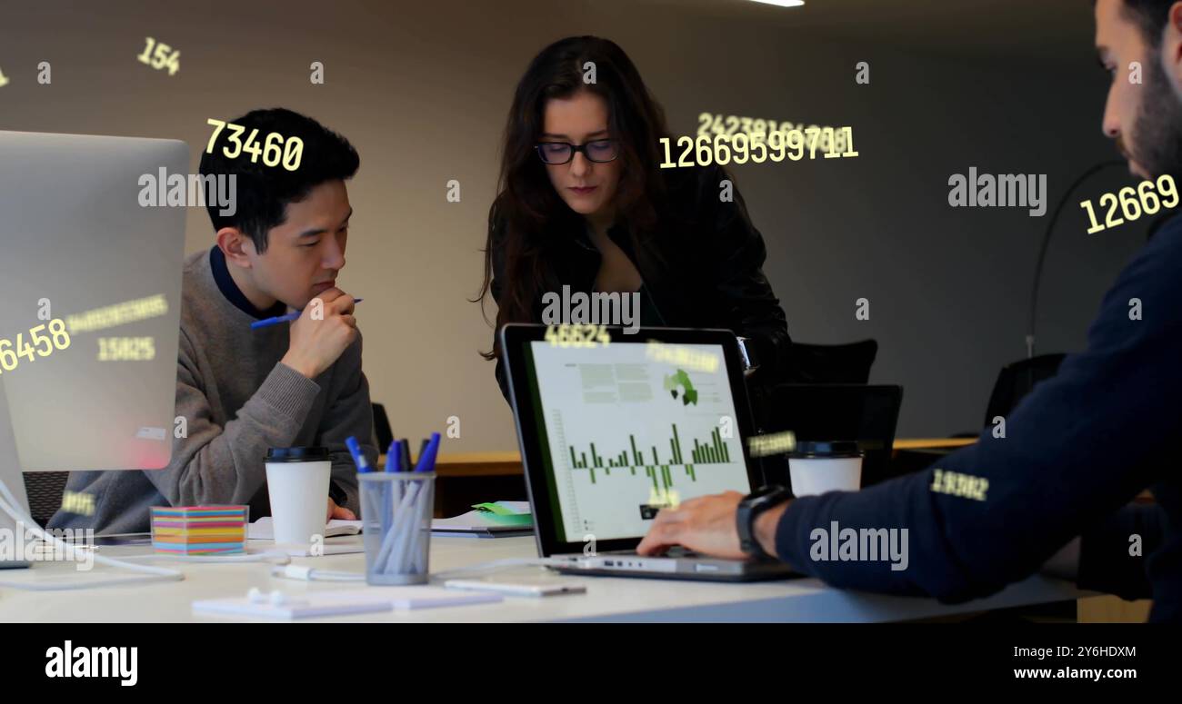 Image of data processing over diverse collleagues working in office Stock Photo