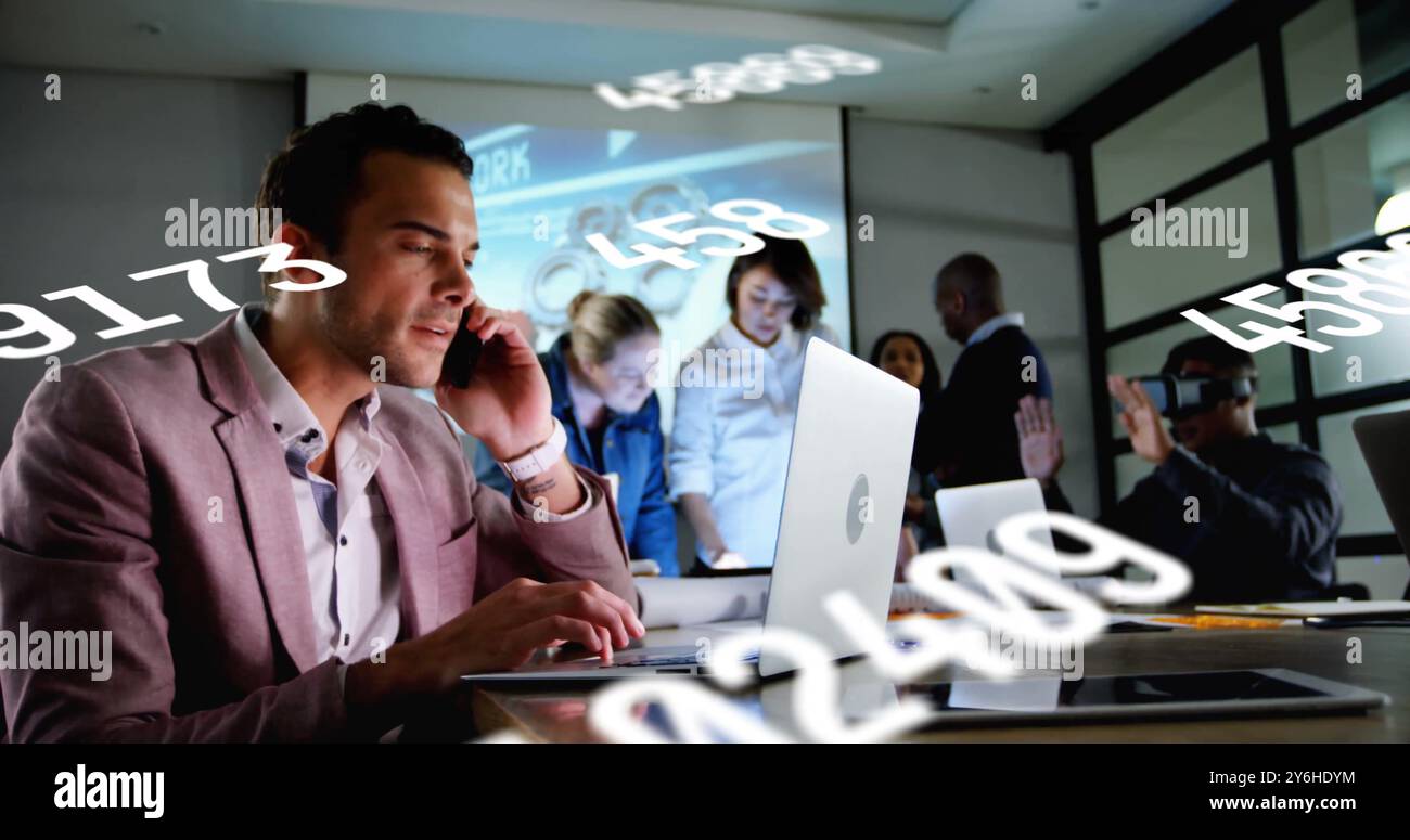 Image of data processing over diverse collleagues working in office Stock Photo