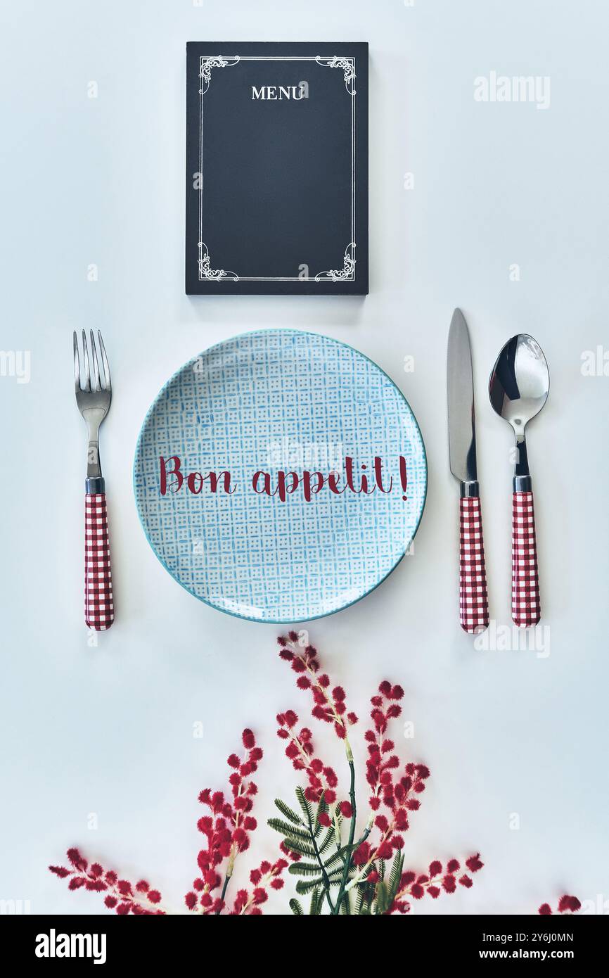 Bon appetit! High angle food concept shot of restaurant stuff on white background Stock Photo