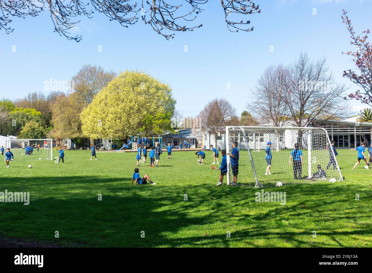 Children playing in sports sport ground ilam primary school chri hires