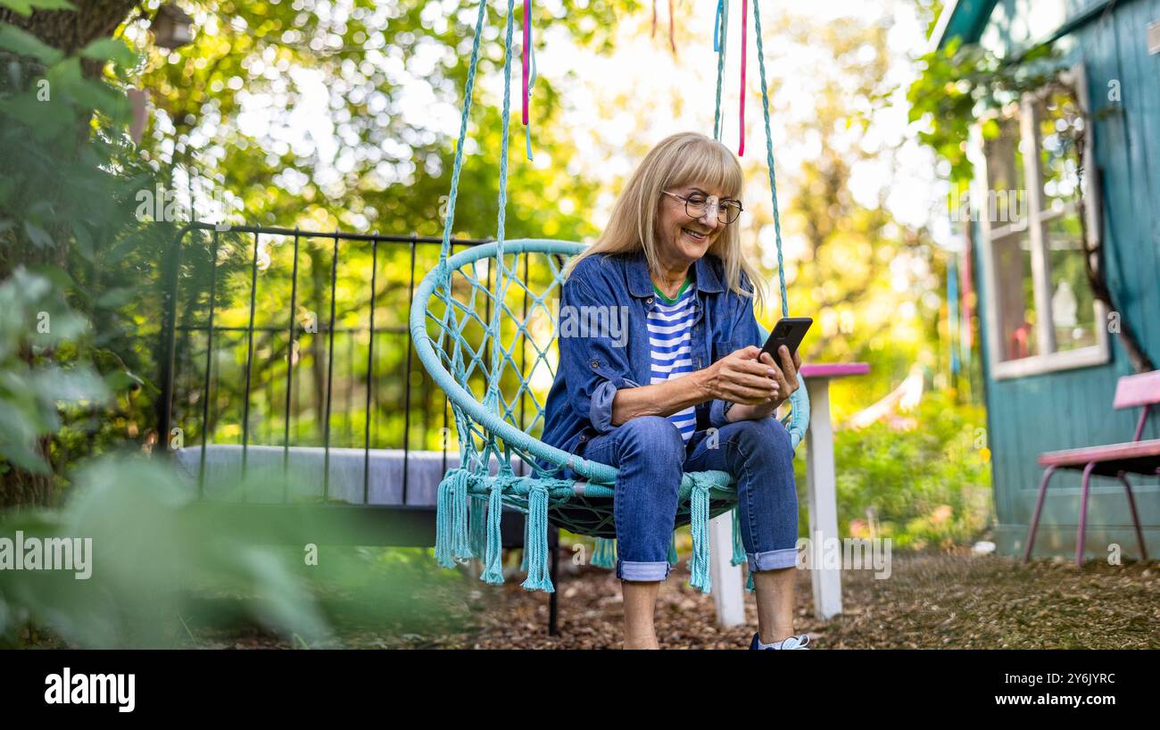 Mature woman summer swing hi-res stock photography and images - Alamy