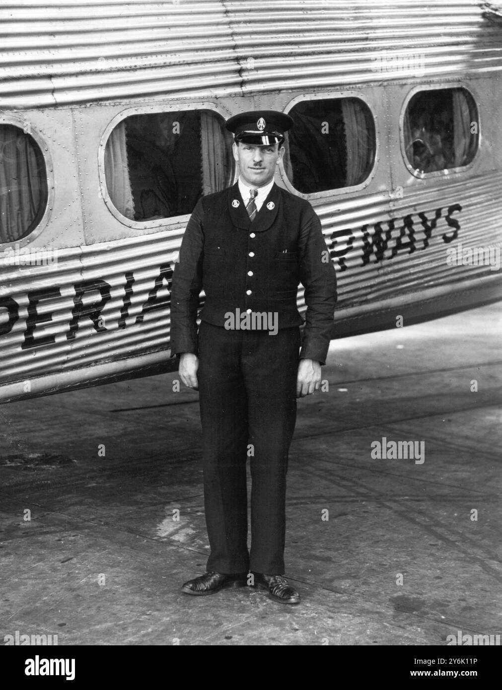 An Imperial Airways Steward beside an HP 43 The stately Handley Page Airliners Stock Photo
