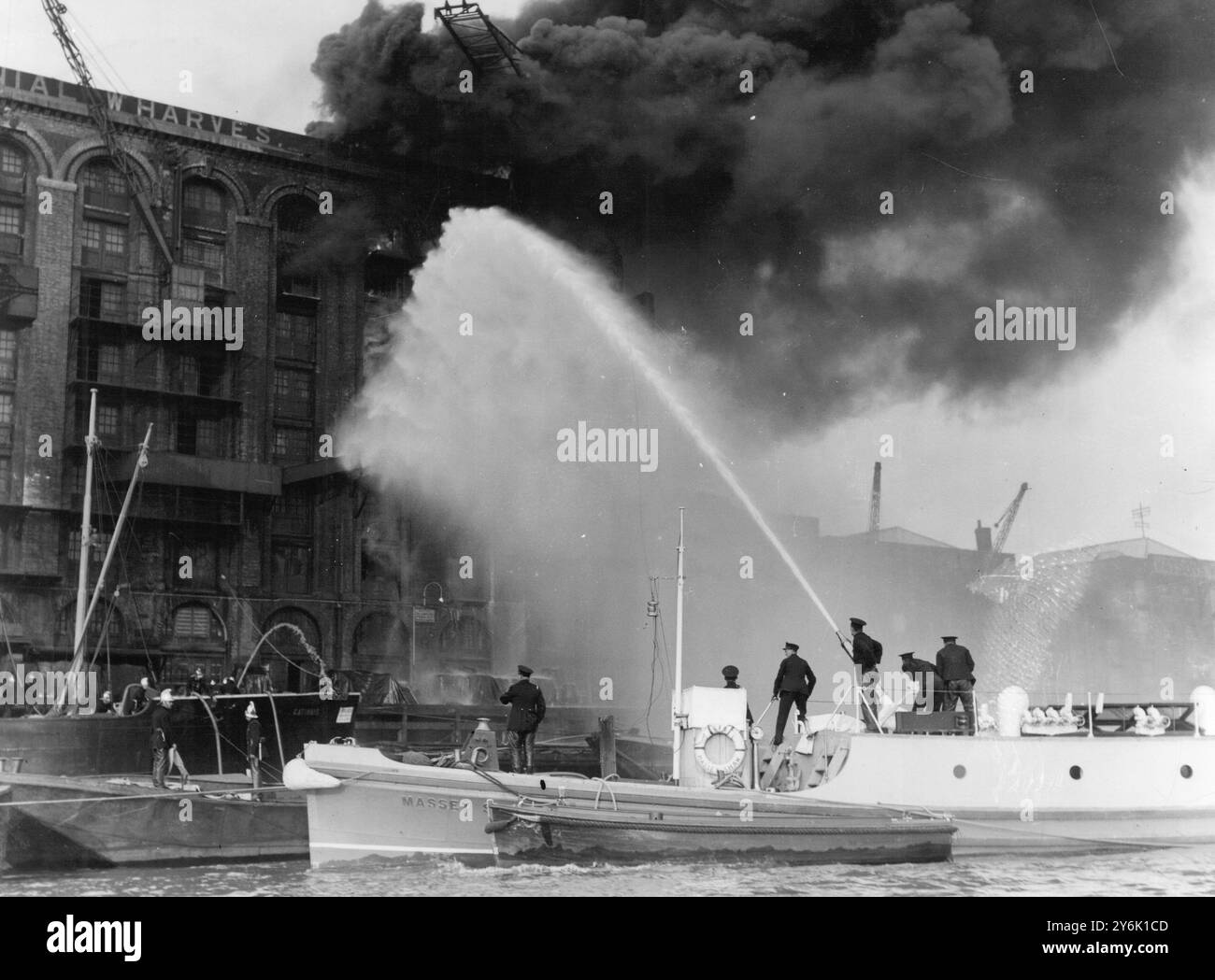 Fire which threatens the whole of London's dockland is raging at a tea ...