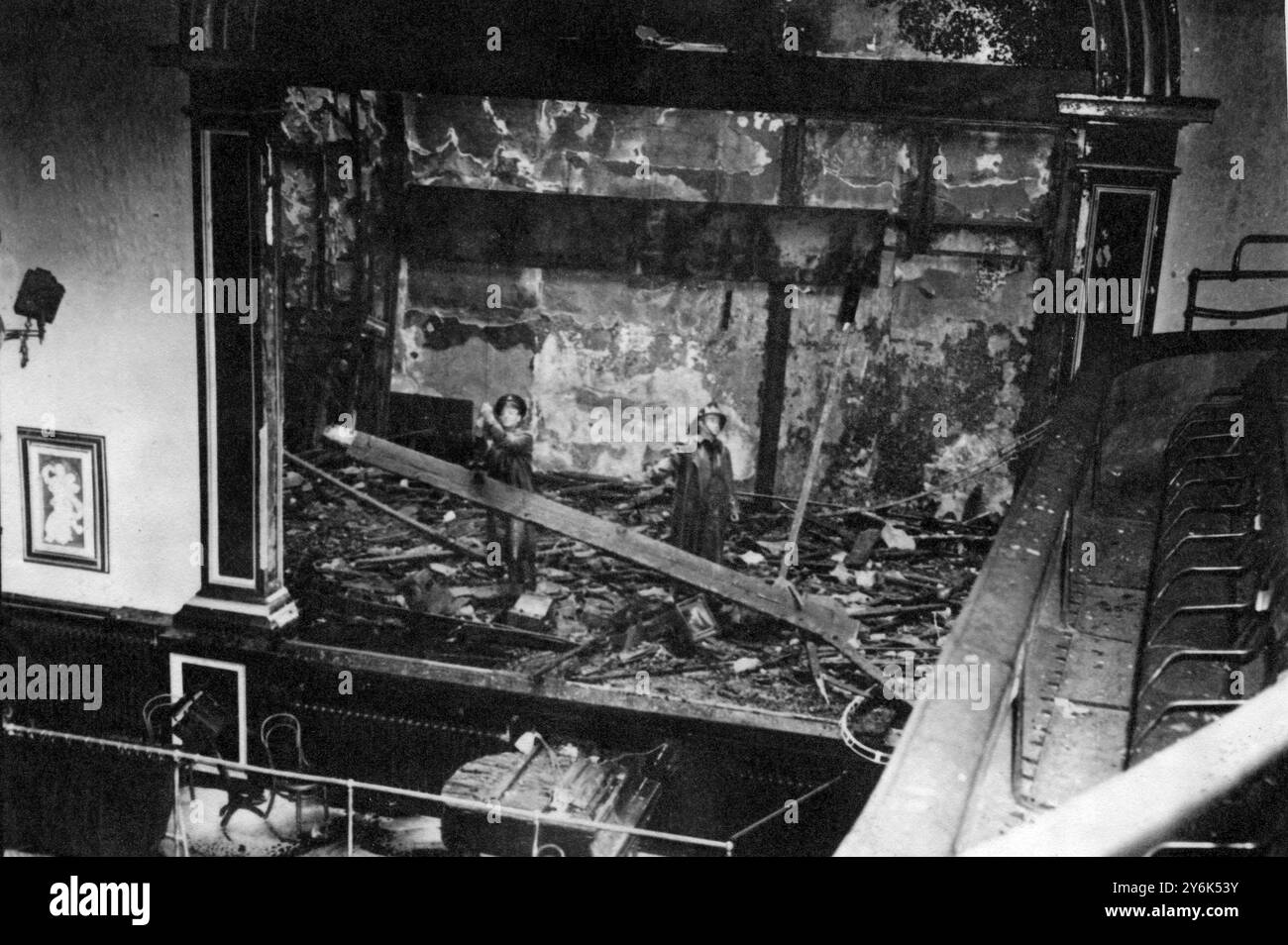 Dublin : Dublin 's famous Abbey Theatre was ablaze in the early hours of this morning with flames bursting through the roof.  Five sections of the Dublin Fire Brigade were called to battle the inferno. Firemen are on the wrecked stage salvaging what they can of the debris  18th July 1951 Stock Photo