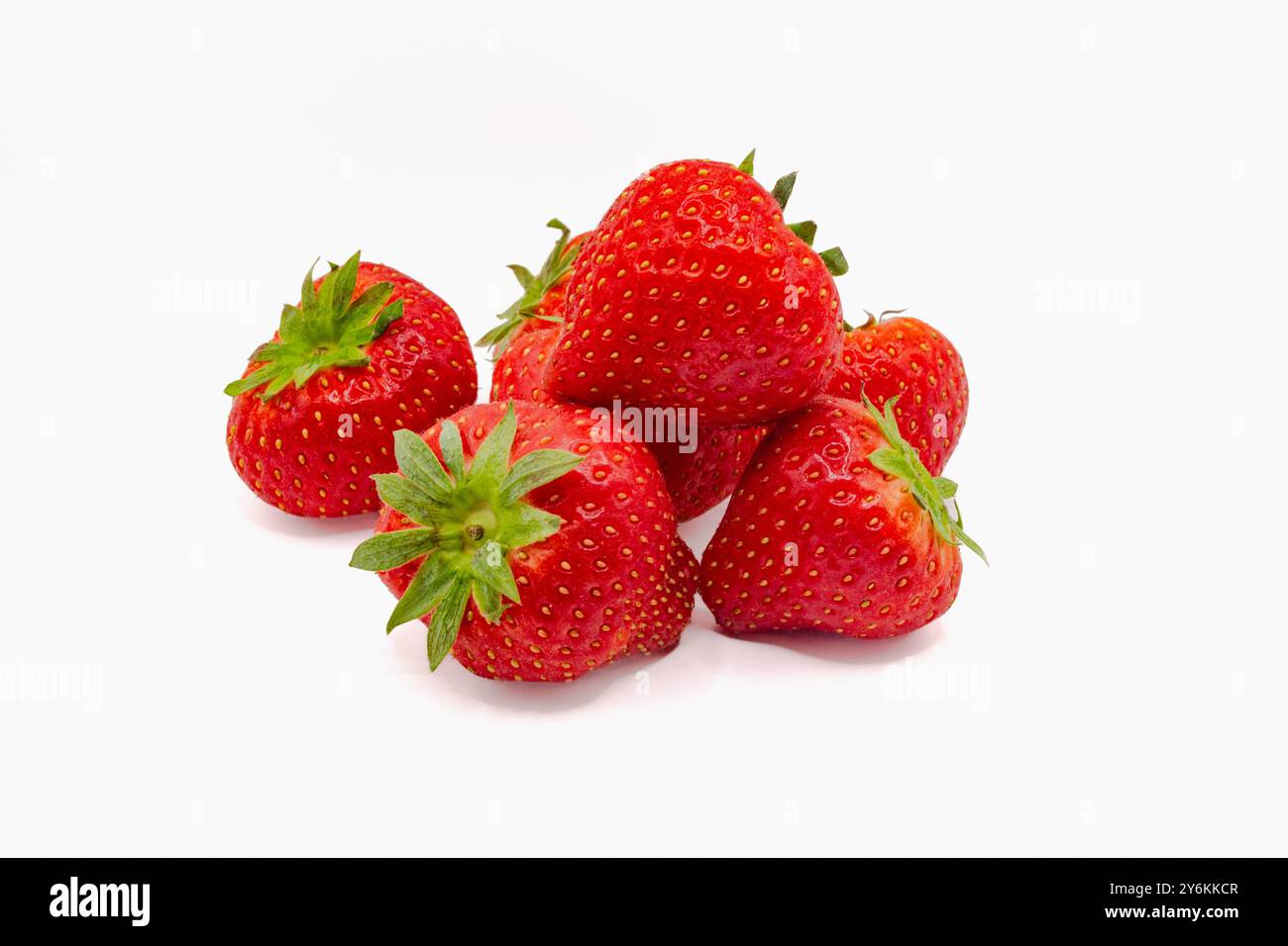 Fresh organic strawberries with green leaves isolated on white ...