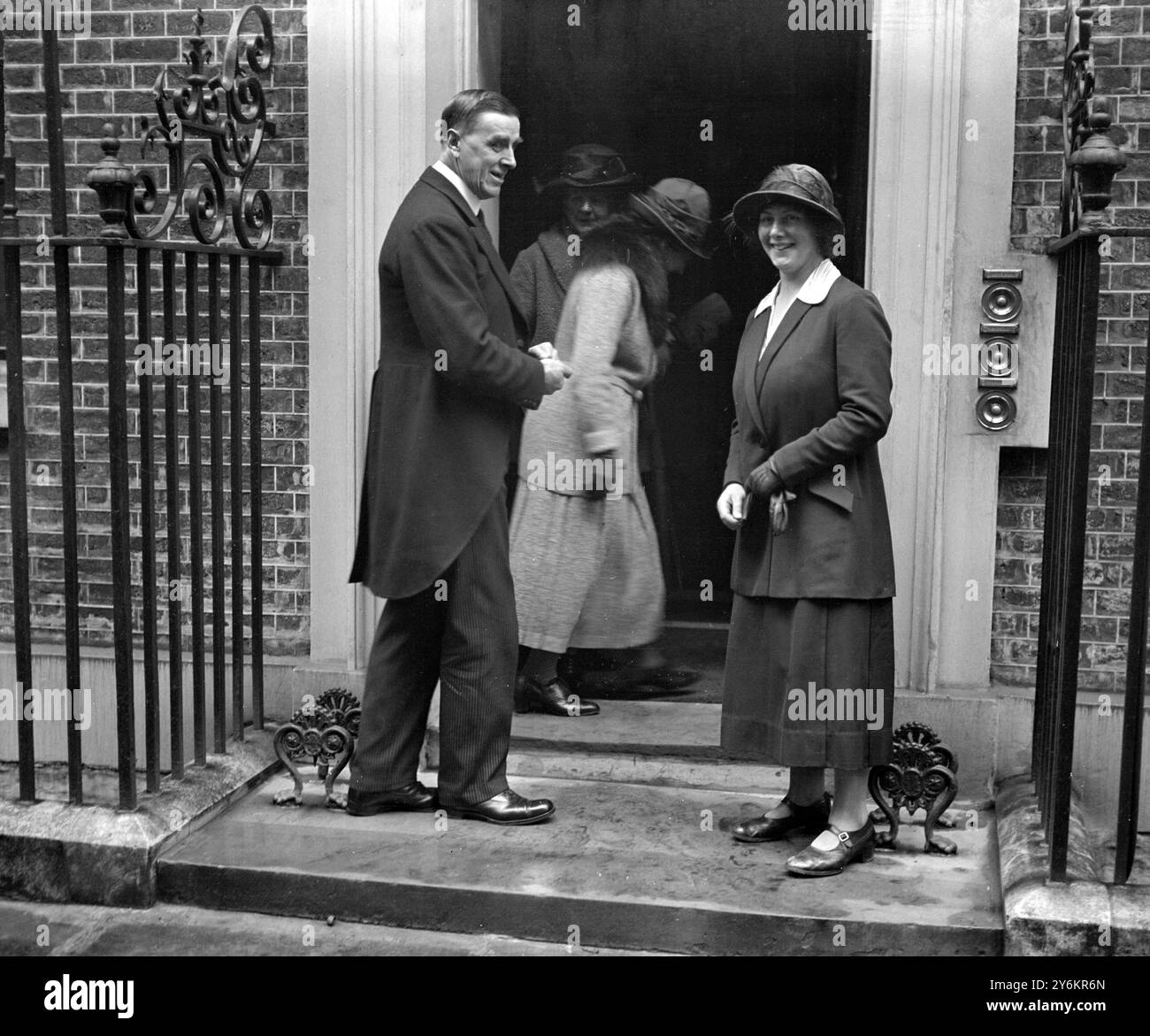 Miss Ishbel MacDonald, daughter of the Premier, with the butler at No10 Downing Street when she paid a visit of inspection. 22 January 1924 Stock Photo