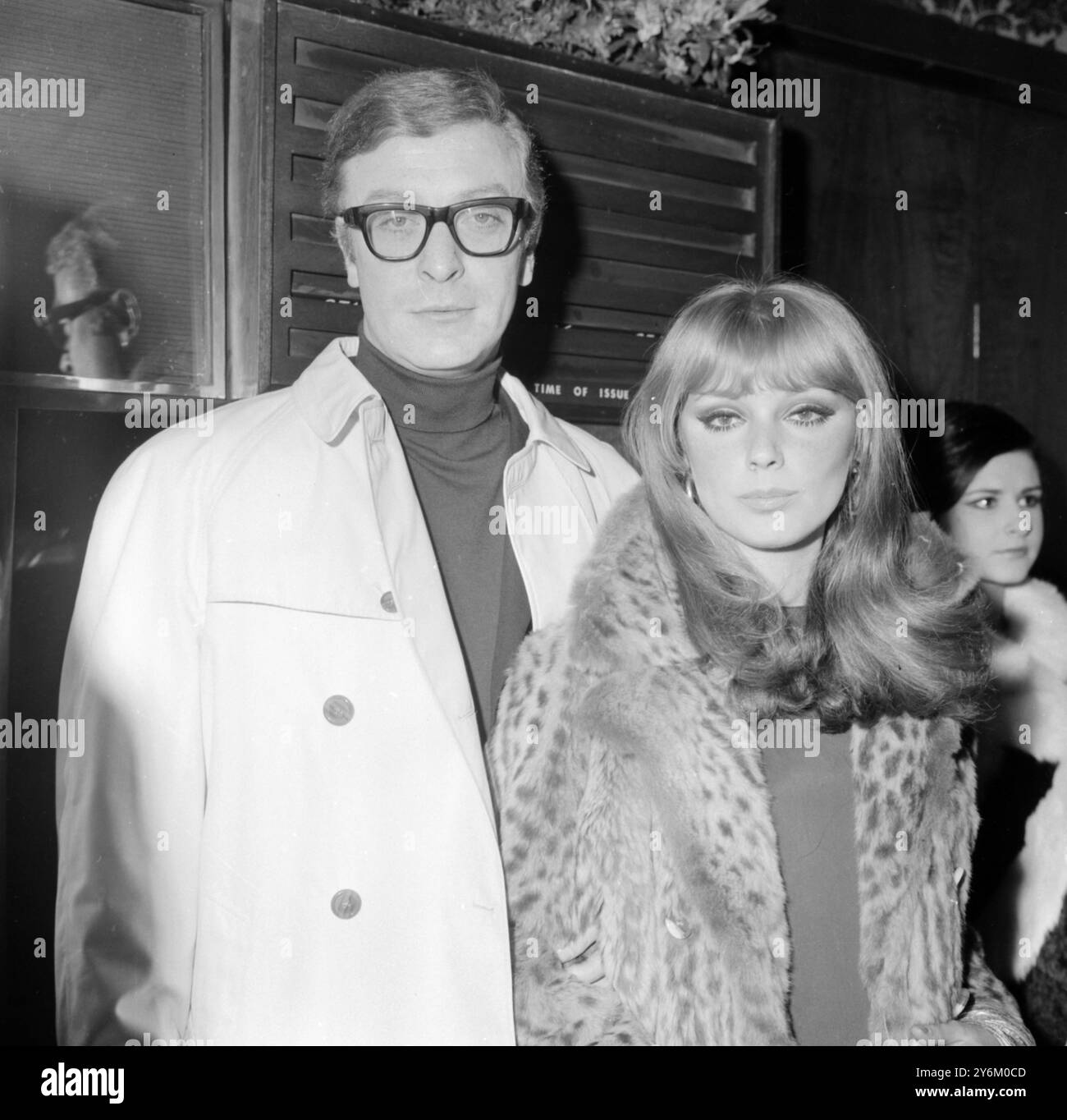 London: Cockney Actor Michael Caine and French Actress Elizabeth Ercy are pictured arriving for the Gala Premiere tonight, of Britain's official entry for the Cannes film Festival, 'Alfie.'. 'Alfie' follows the romantic adventurers of an amoral Cockney who collects 'Birds' the way other men collect stamps. Michael Caine, a Cockney himself, plays the title role.  24 March 1966 Stock Photo
