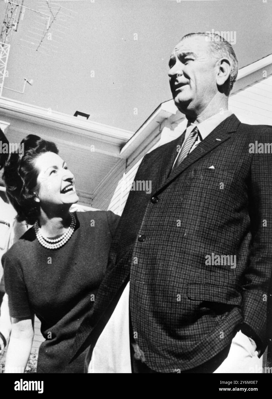 Johnson City, Texas: He is the head of a family, and the head of the United States He is six feet two-inches, tall Texan. he is US President Lyndon B. Johnson, getting an admiring glance from his wife, Mrs Claudia 'Lady Bird' Johnson, as they are pictured on their ranch in central Texas, where they spent the Christmas Holiday. 28 December 1963 Stock Photo