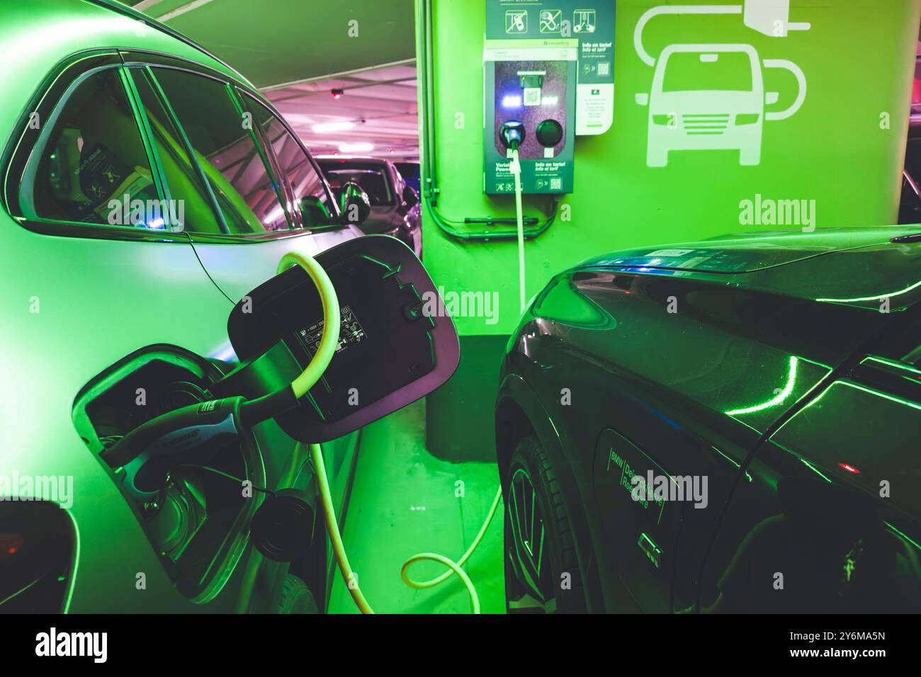 Electric car charging station, in an underground car park Stock Photo ...
