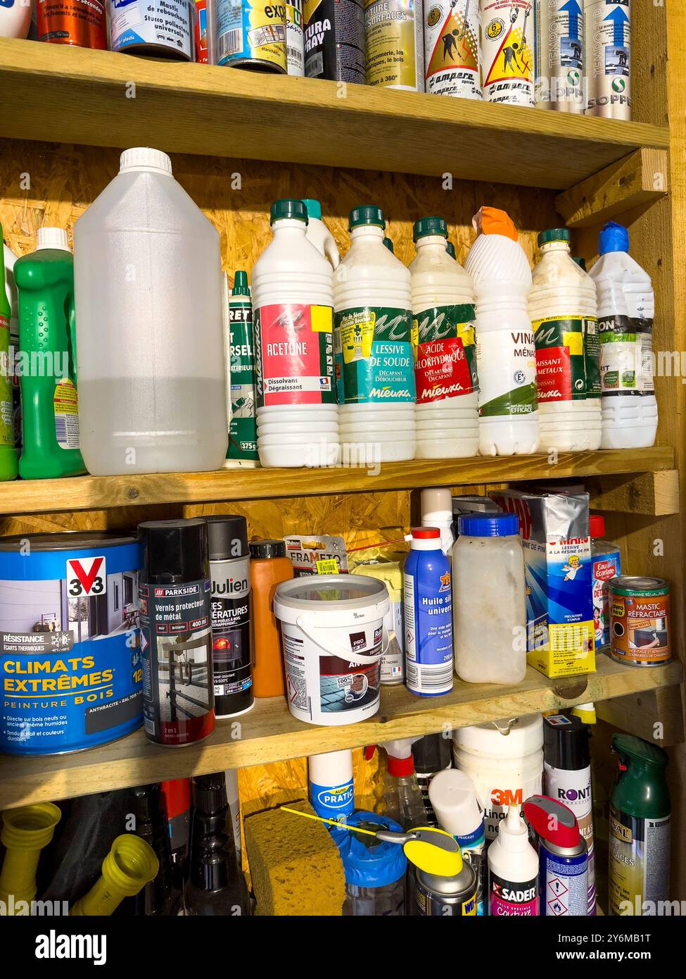 Different products on shelves in a garage. Stock Photo