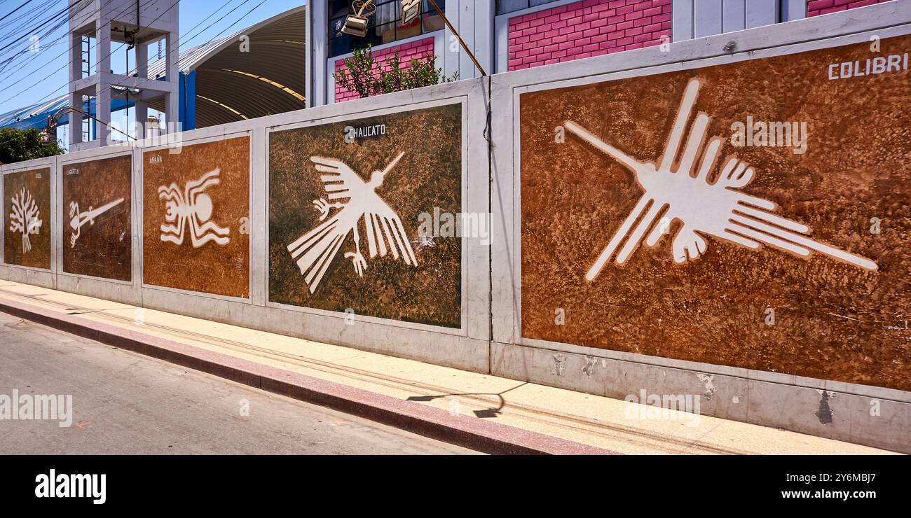 Murals depicting the famous Nazca lines adorn a street wall ...