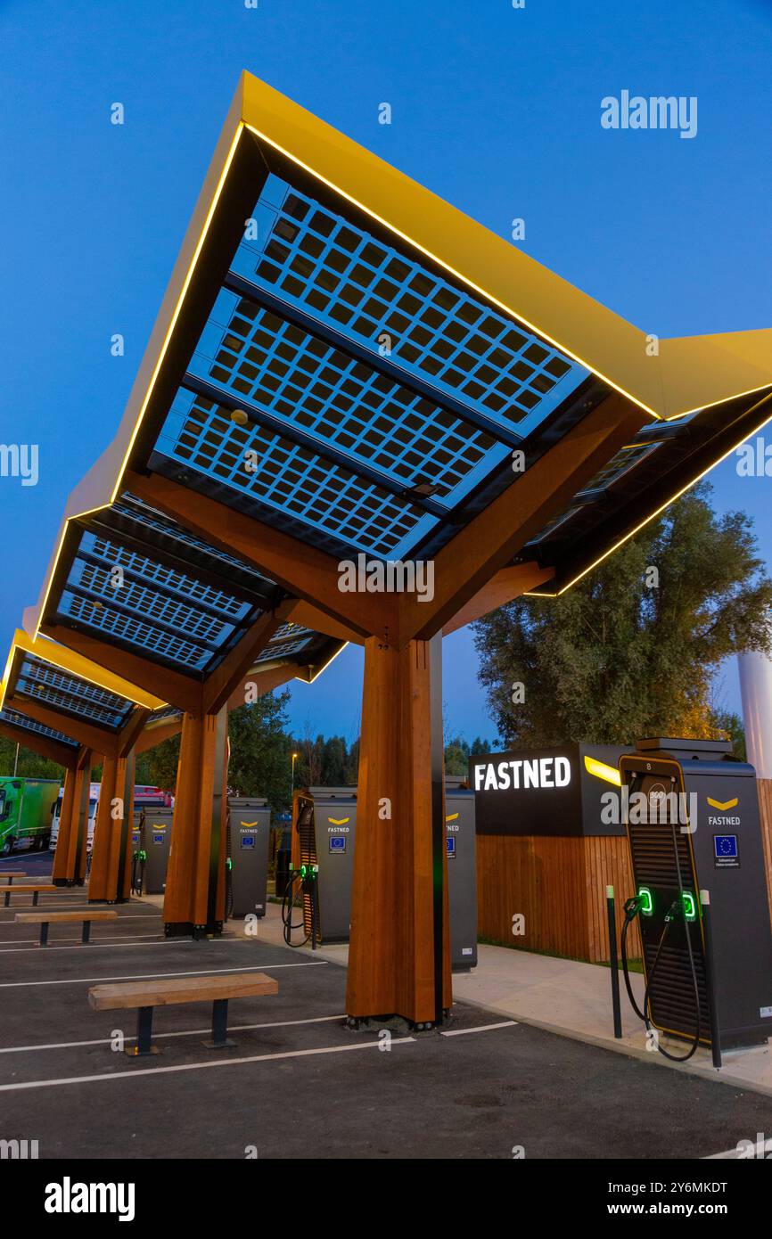 Electric car charging station on a motorway rest area. Fastned Stock ...