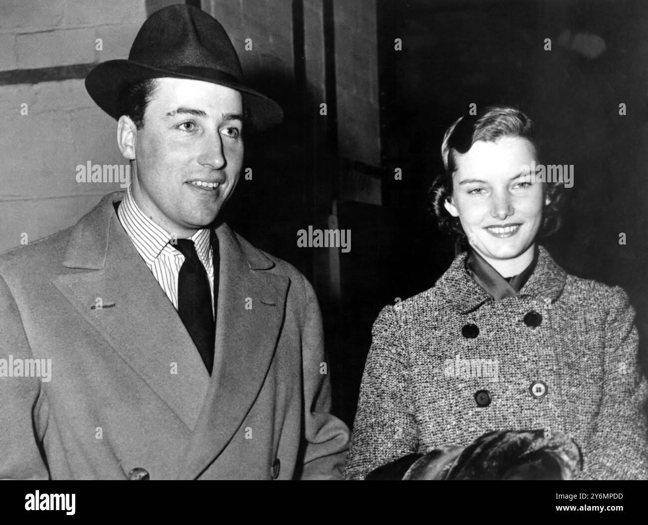 Lord Porchester, 31 year old former escort of Princess Margaret, is me by his bride-to-be, Jean Wallop, daughter of a Wyoming rancher, as he arrives here aboard the liner Queen Mary.  They are to marry St James Episcopal Church, New York, on 7th January. 5th January 1956 Stock Photo