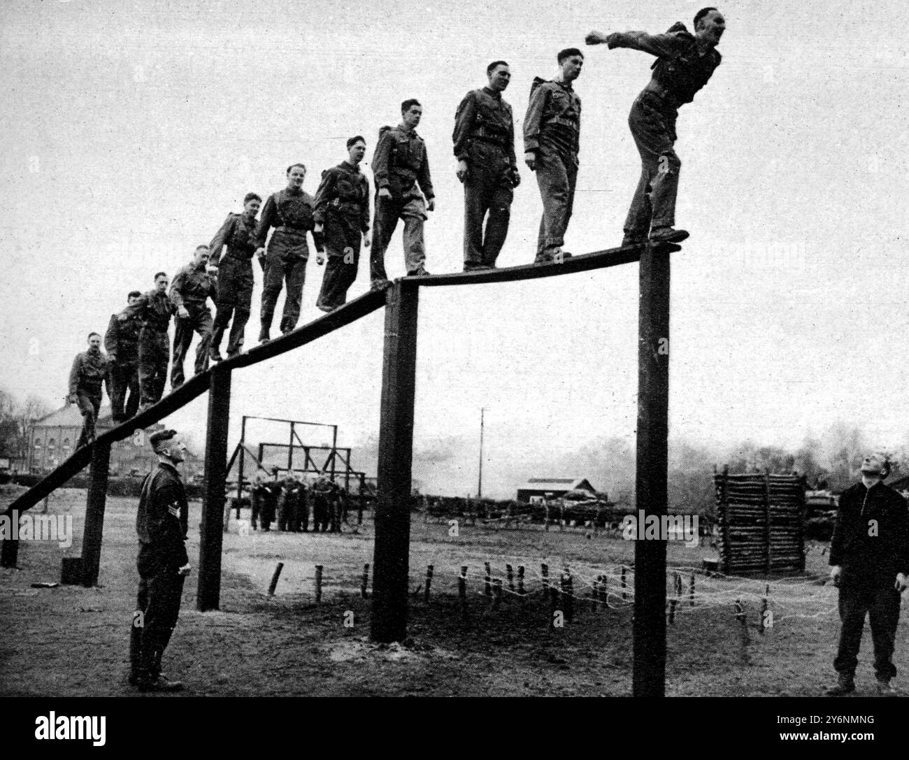 The New Sandhurst. The Royal Armoured Corps OCTU at work. Nerve balance physical fitness and agility tests for the cadets The ramp, third stage in parachute landing training, a 12ft drop. In the background can be seen othe obstacles  April 1943  ©2004 Topfoto Stock Photo