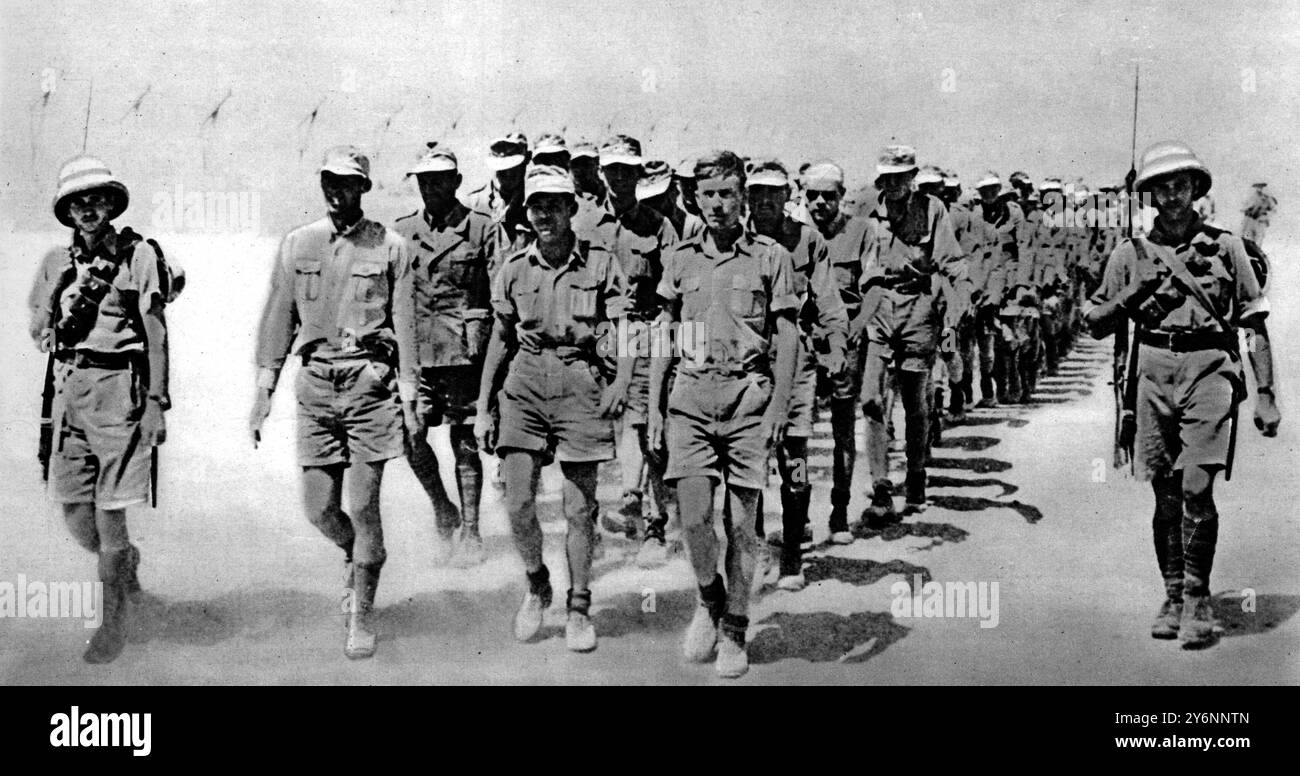 A batch of German prisoners marching sullen faced to an internment camp ...