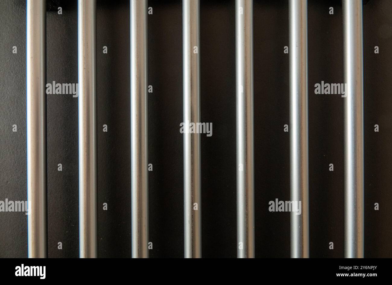Shiny steel bars on a black background. Stock Photo