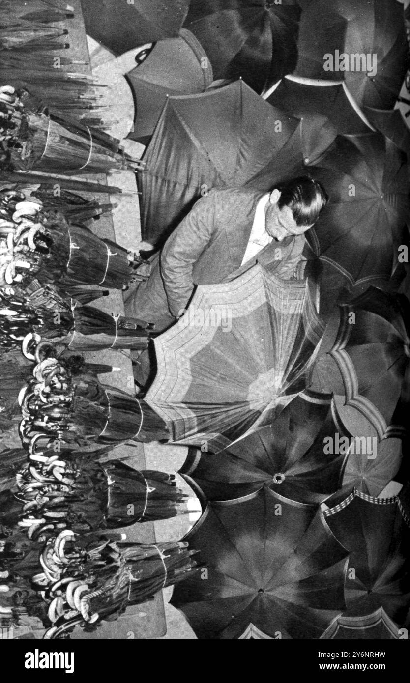 Forgetfulness by tons and thousands: how London, the absent minded, keeps lost property offices busy. Umbrellas stacked up in the Lost Property office  March 1938 Stock Photo