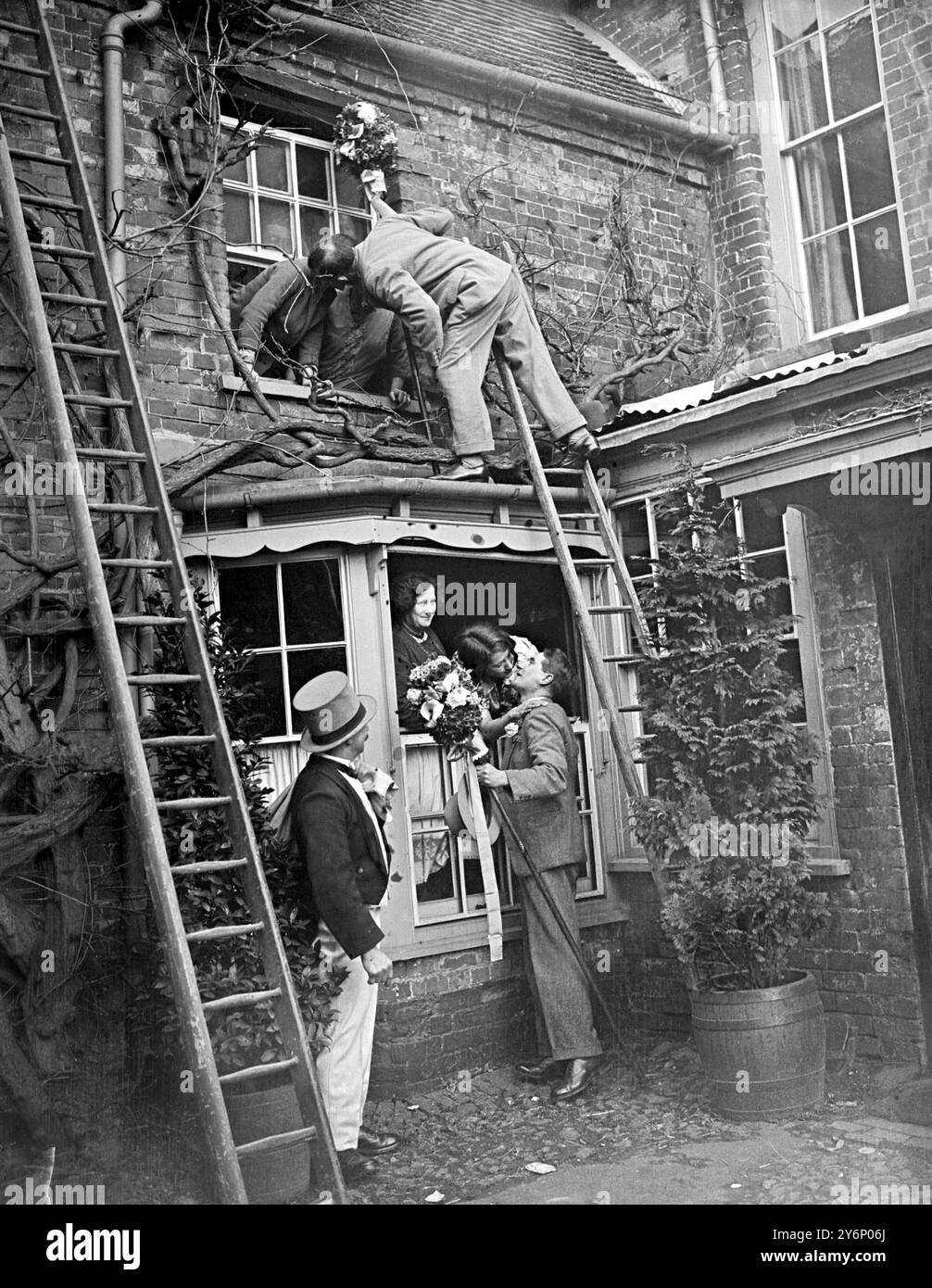 Ancient Hocktide Custom Observed at Hungerford: Tutti-men claiming their toll of kisses during the festival at HUngerford. 5 April 1932 Stock Photo