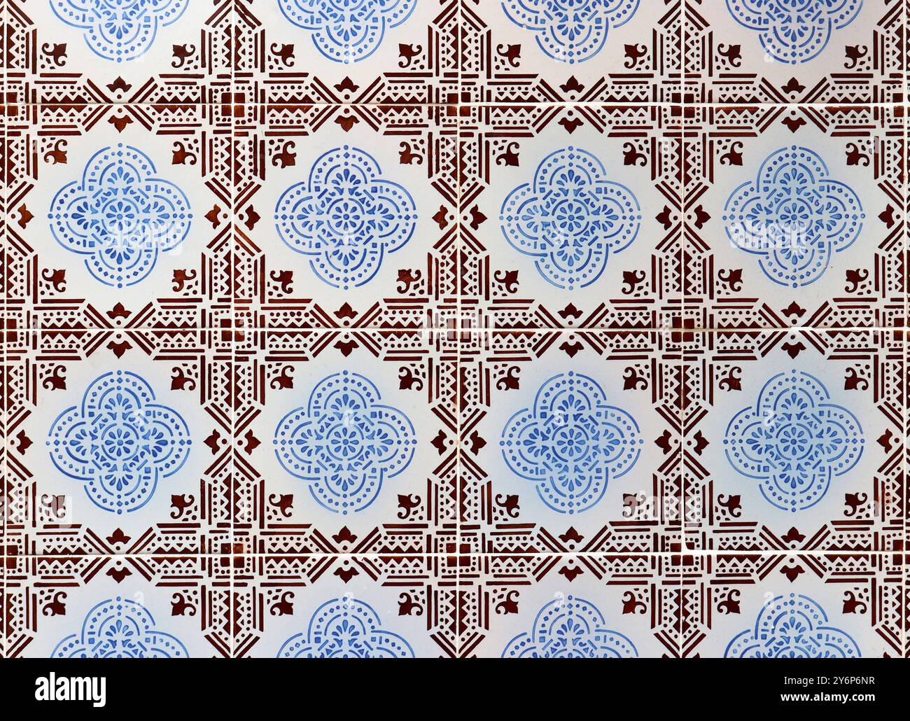 Azulejos, traditional Portuguese tiles on house wall, background in blue, auburn and white Stock Photo