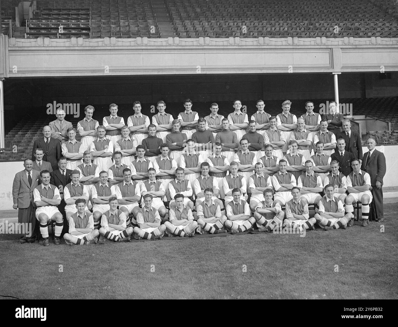 ARSENAL AT FULL STRENGTH   This is the latest picture of the Arsenal football club players together with members of staff, made at Highbury ground, North London.  reading from top row and left to right in all cases;  top row-  E.collett: Lesley Pilkington : James Gray: Clifford Houlton: Raymond Barr : Colin Grimshaw : Edmund Davies : William Duffy : Alex horsefield : William Healey : Noel Kelly : F.Grosvenor : (staff).  SECOND ROW- Mr.George Male : Ernest Stanley : John Chenhall : John Babes : Norman Upritchard : George Dunkley : Edward Platt : A.Kelsey : George Swinding : Donald Oakes : John Stock Photo