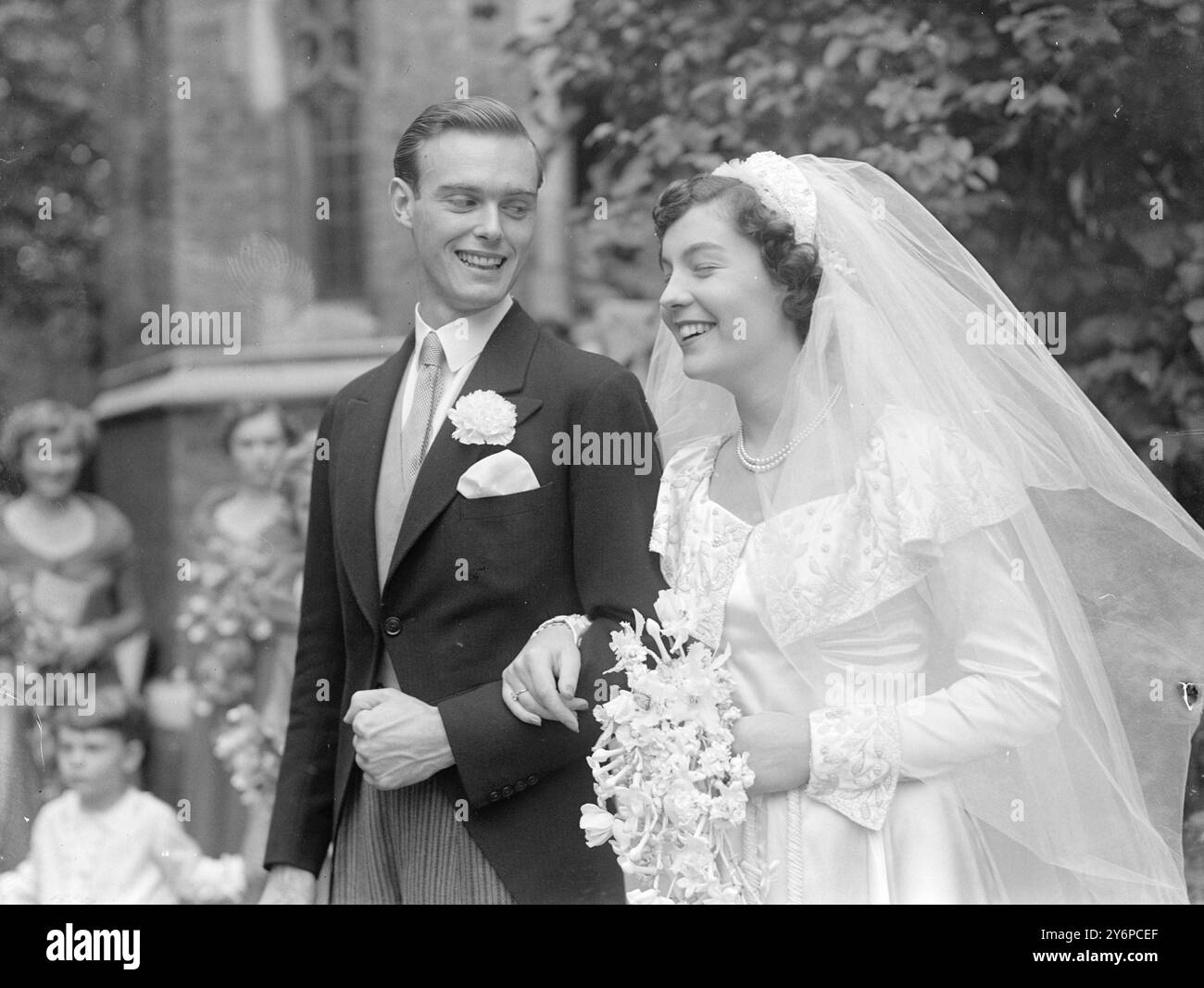 ' LITTLE SALESWOMAN ' WEDS-- SHE'S THE DAUGHTER OF HARROD'S CHIEF     Miss Susan Woodman Burbidge , daughter of Sir Richard Burbidge , chairman of Harrods , and of Gladys Lady Burbidge , was married today in Holy Trinity Church , Brompton Road , London , to Mr . Michael D.L. Pearson , of Oran Court , Hampstead , London .   The bride , dark-haired and hazel-eyed , is 22 years old .   The groom is 26 years old and is the son of Mr . Deric E.W. Pearson and of Mrs . Frank le couteur , He served in the Royal Navy during the last war and is currently employed in the advertising business in London . Stock Photo