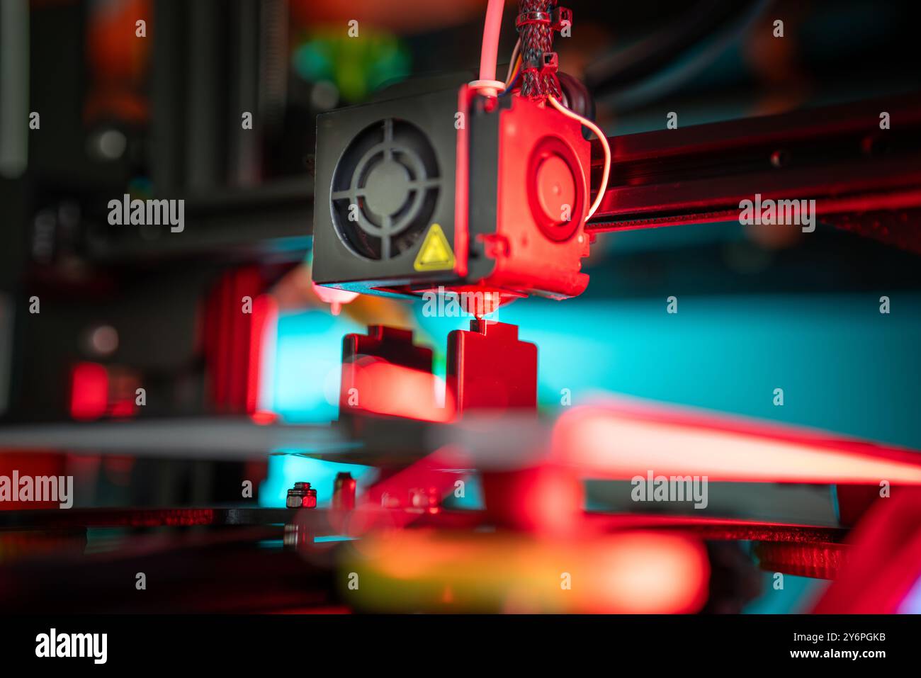 3D printer preparing object. Production prototype. Nozzle clese-up. Stock Photo