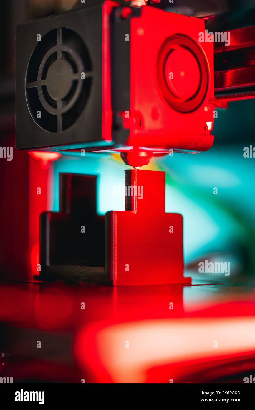 3D printer preparing object. Production prototype. Nozzle clese-up vertical Stock Photo