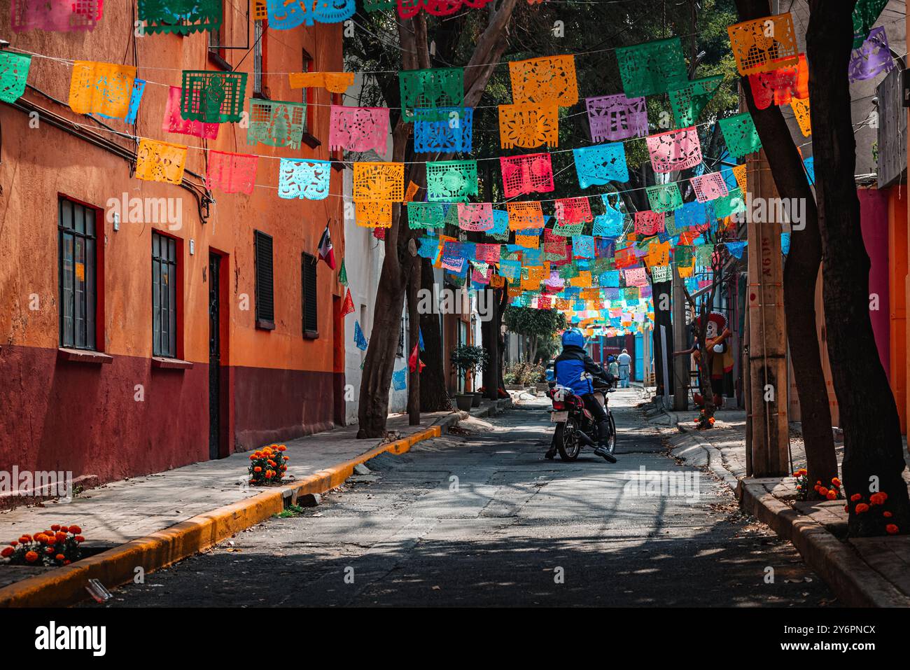 A motorcycle driving down the street during the Day of the Dead in Mexico City Stock Photo