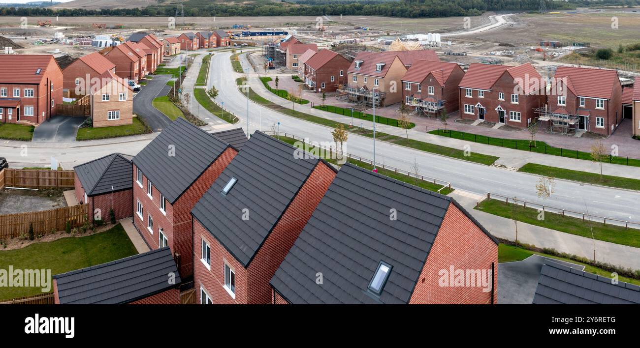 Aerial panoramic landscape view of a new build housing estate with houses under construction to fill the gap in the UK home shortage and supplement th Stock Photo