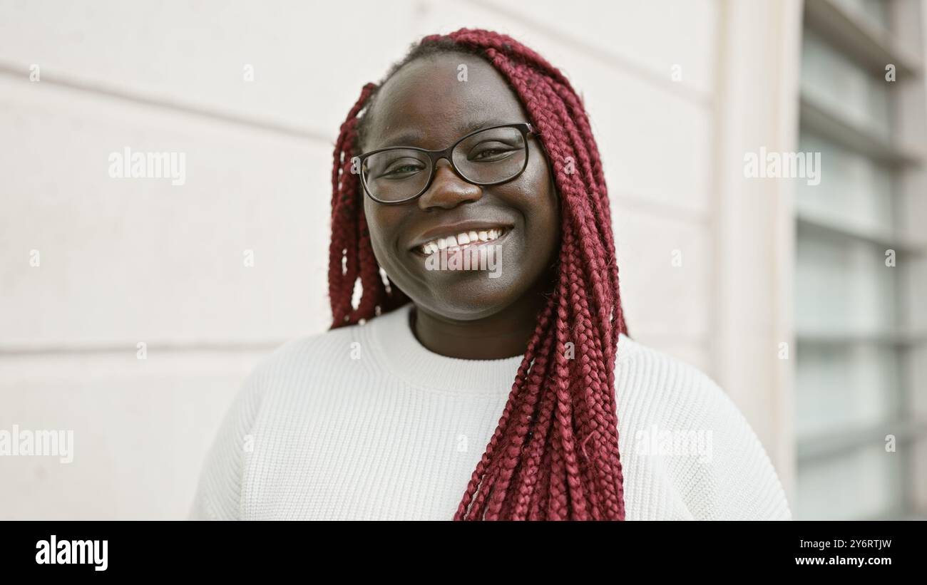 Woman wearing glasses braids hi-res stock photography and images - Alamy