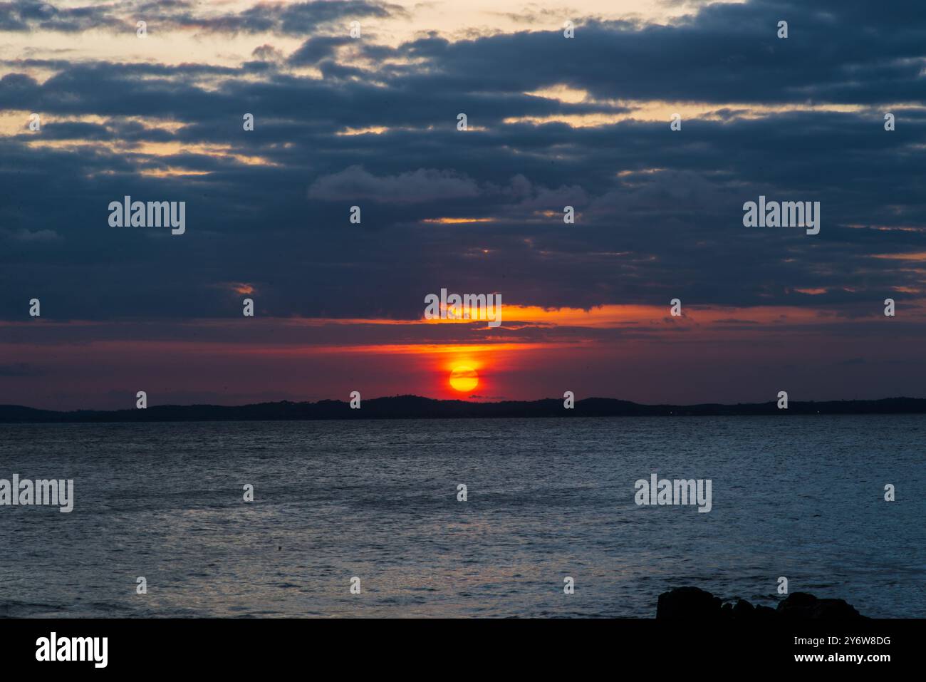 Beautiful dramatic and impressive sunset with dark and dense clouds ...